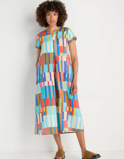 woman wearing bright coloured print linen midi dress