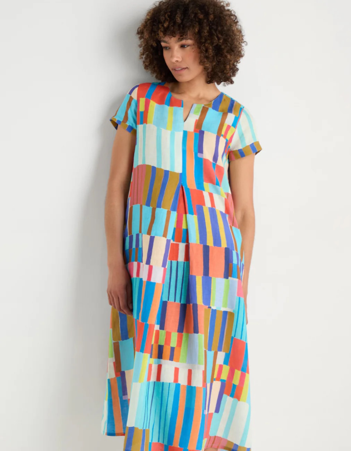 woman wearing bright coloured print linen midi dress