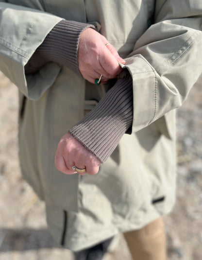 waterproof beige parka coat with hood and ribbed cuffs and stand up collar