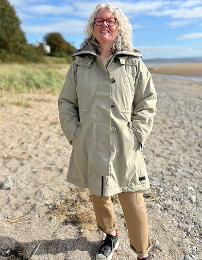 waterproof beige parka coat with hood and ribbed cuffs and stand up collar