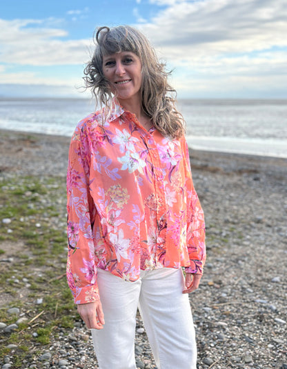 cream jeans with a peach and cream floral cotton blouse