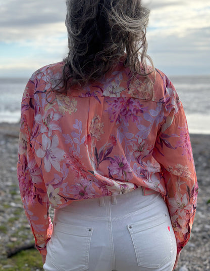 cream jeans with a peach and cream floral cotton blouse