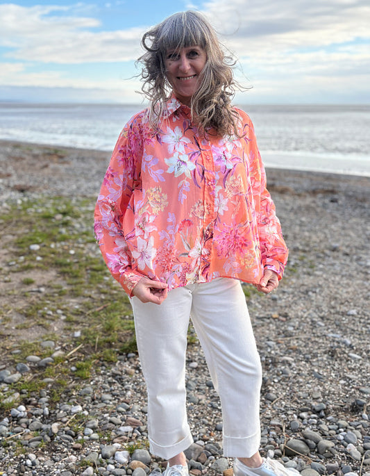cream jeans with a peach and cream floral cotton blouse