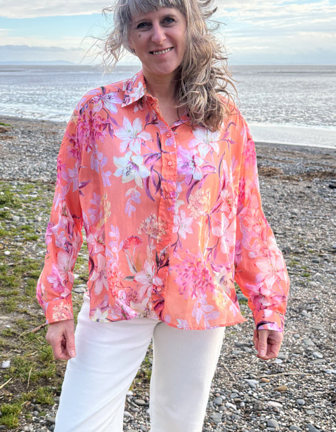 cream jeans with a peach and cream floral cotton blouse