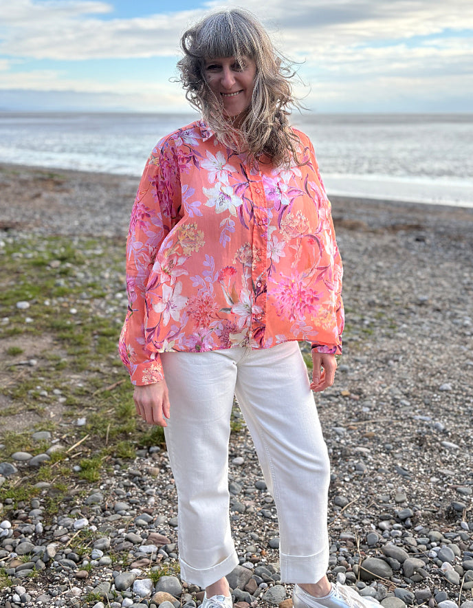 cream jeans with a peach and cream floral cotton blouse