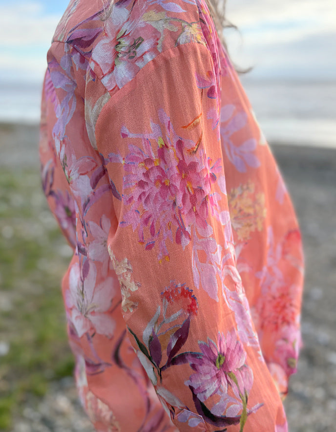 cream jeans with a peach and cream floral cotton blouse