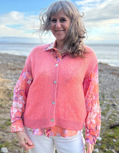 knitted wool tank waistcoat worn over a floral cotton blouse in peach and pink florals