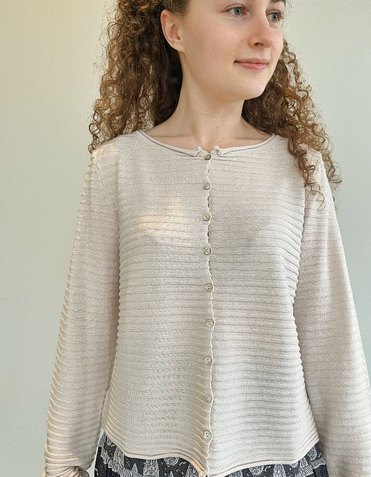 short wide boxy cardigan with ribbed texture, long sleeves and scoop neck in cream