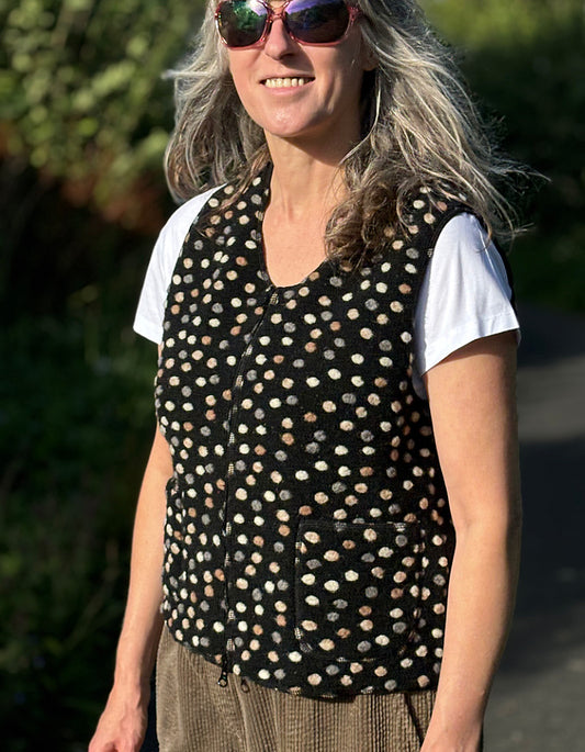 black boiled wool zip up vest with neutral felted pebble details