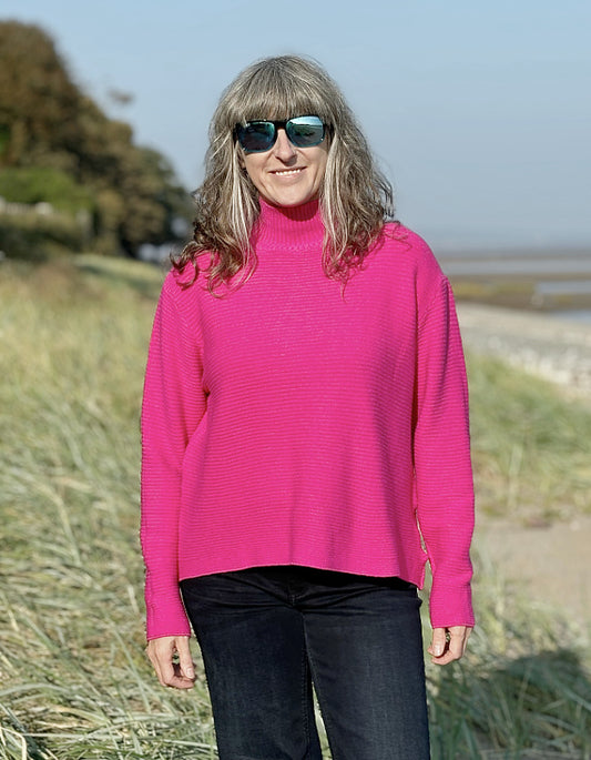 hot pink ribbed turtle neck sweater made from non wool yarns