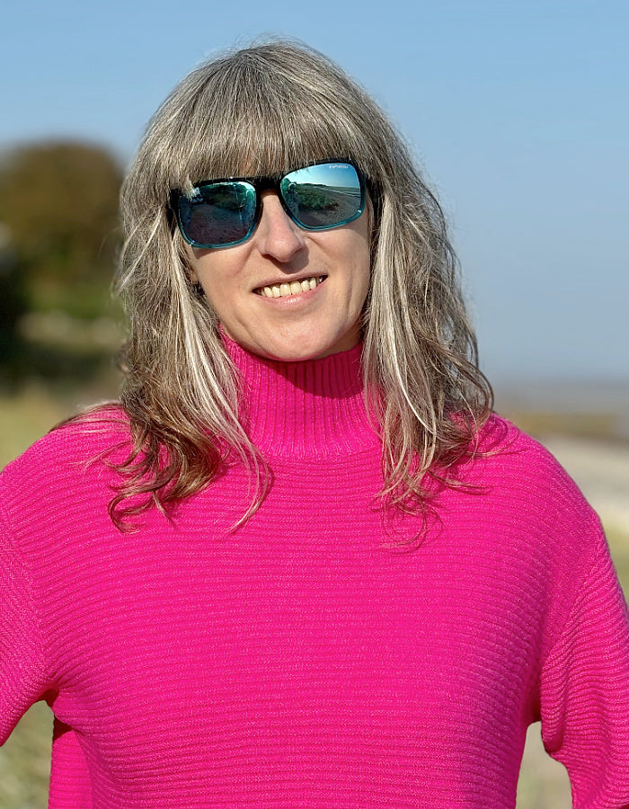 hot pink ribbed turtle neck sweater made from non wool yarns