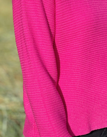 hot pink ribbed turtle neck sweater made from non wool yarns