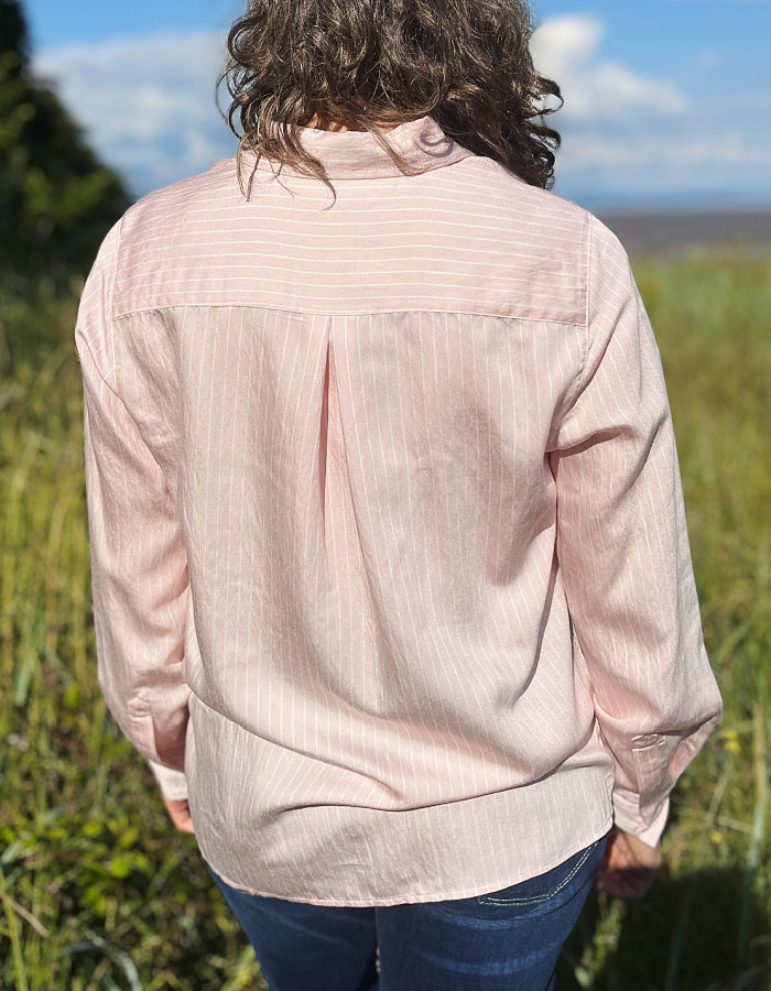 soft baby pink shirt with collar and button down front with white pin stripes