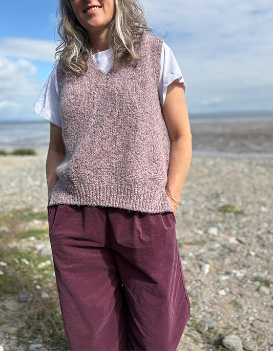woman wearing tank top and burgundy lantern trousers