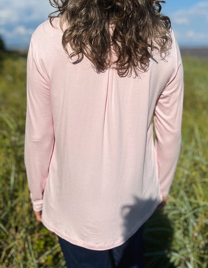 powder pink chiffon blouse with v-neckline and full length sleeves