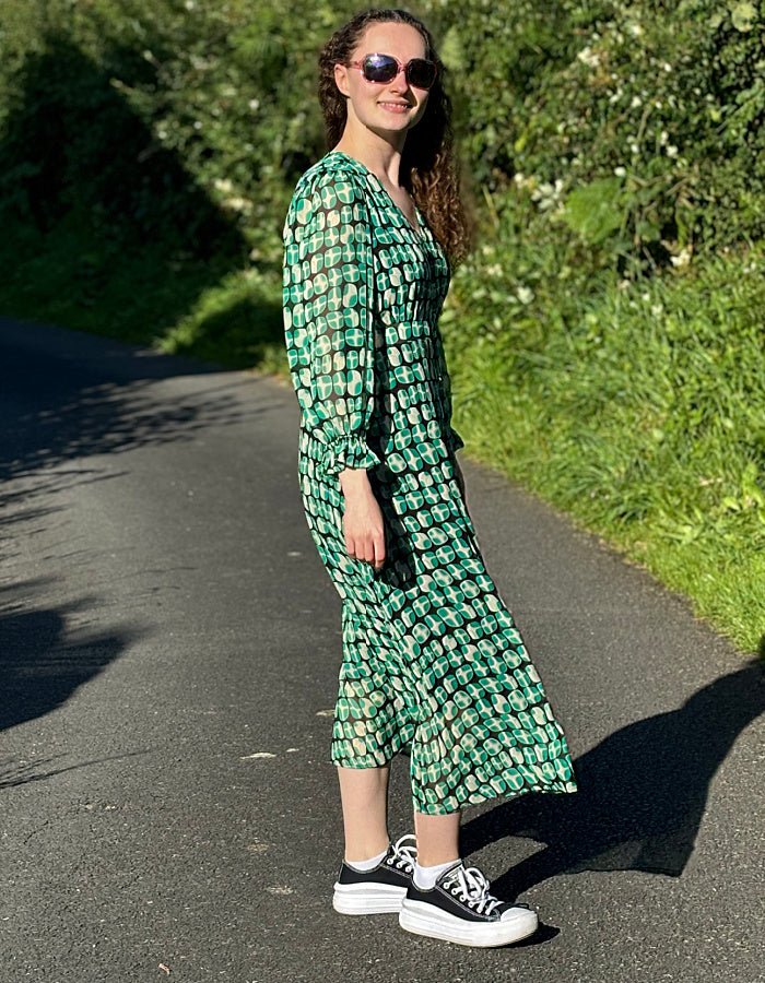 green geometric print midi dress