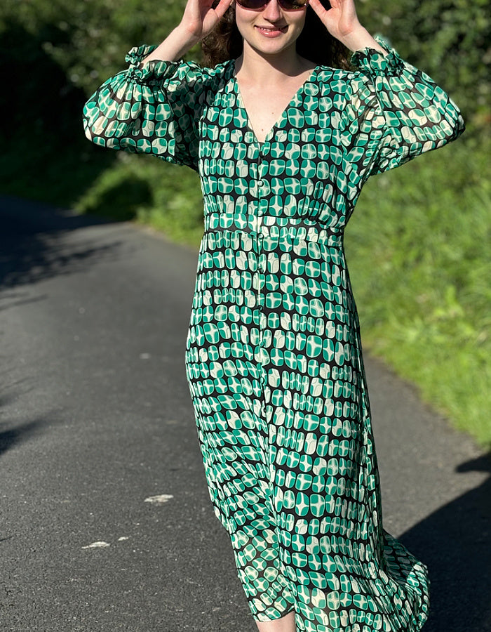 green geometric print midi dress