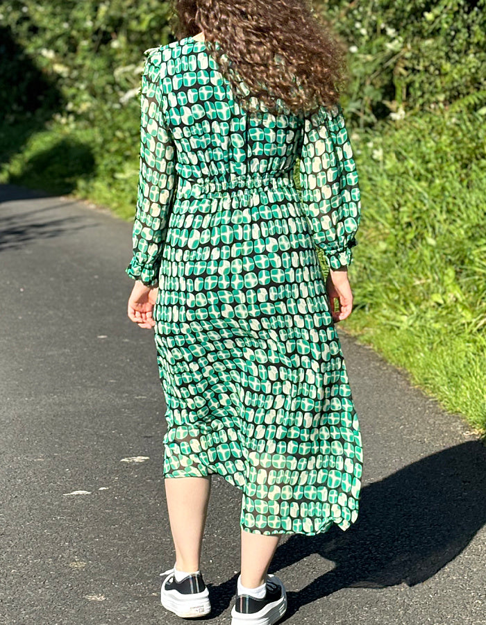 green geometric print midi dress