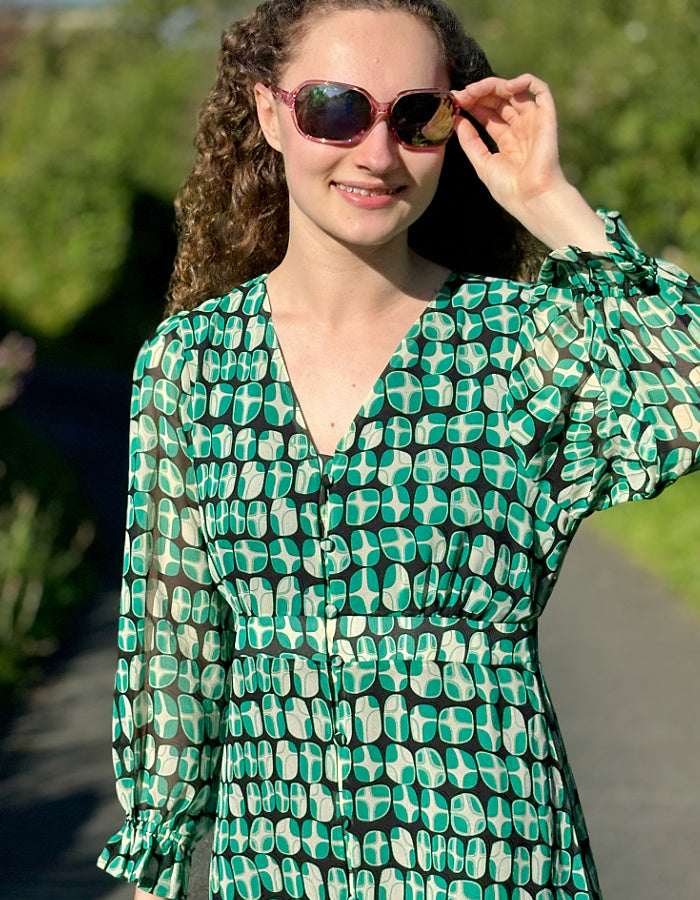 green geometric print midi dress