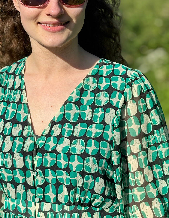 green geometric print midi dress