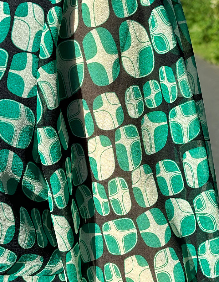 green geometric print midi dress