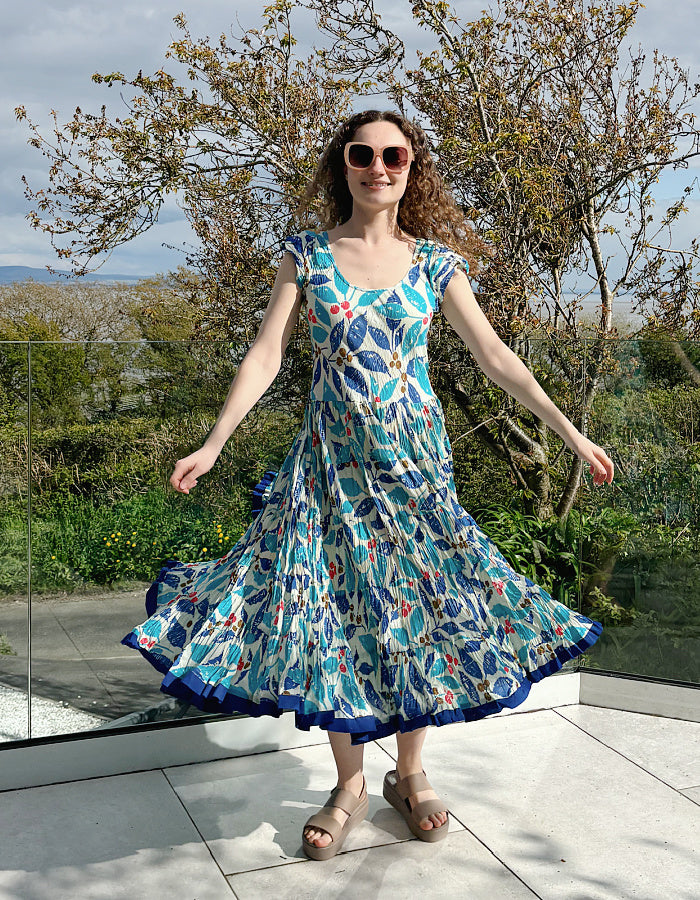 turquoise, blue and red hand block print cotton summer dress with scoop neck and capped sleeves and a full skirt