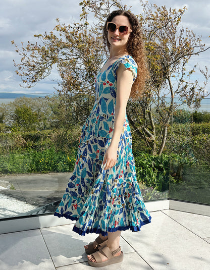 turquoise, blue and red hand block print cotton summer dress with scoop neck and capped sleeves and a full skirt