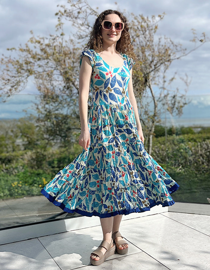 turquoise, blue and red hand block print cotton summer dress with scoop neck and capped sleeves and a full skirt