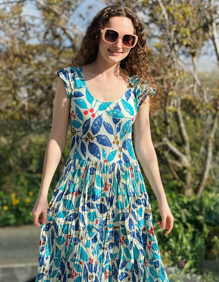 turquoise, blue and red hand block print cotton summer dress with scoop neck and capped sleeves and a full skirt