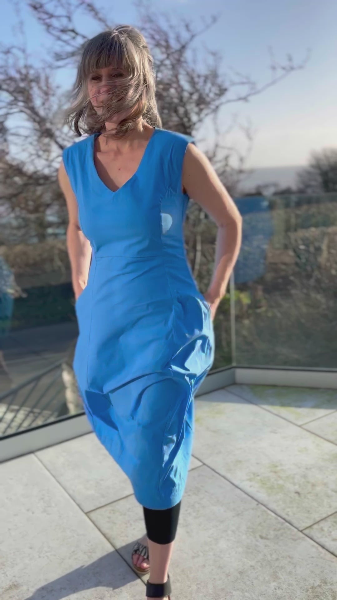 stretchy trapeze midi length bubble dress with v neckline and sleeveless design in stunning cornflower blue colour