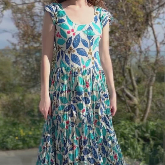 turquoise, blue and red hand block print cotton summer dress with scoop neck and capped sleeves and a full skirt