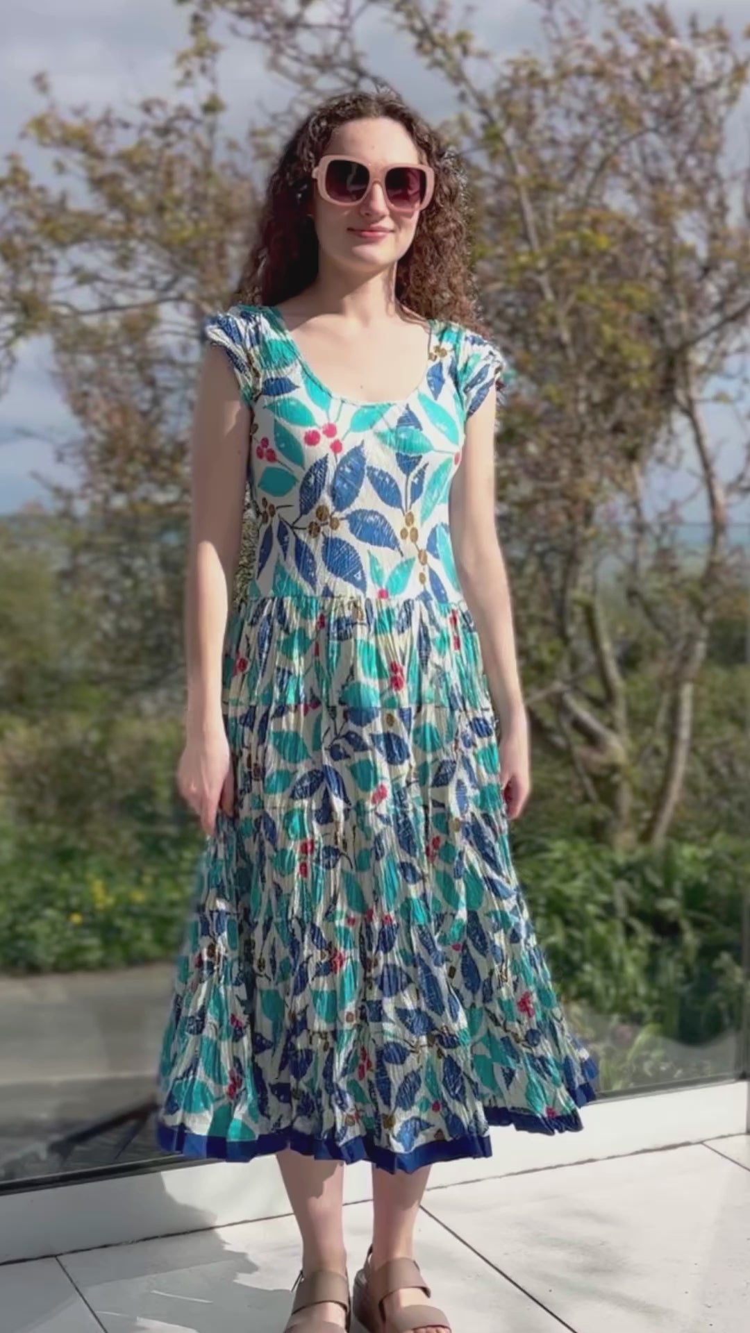 turquoise, blue and red hand block print cotton summer dress with scoop neck and capped sleeves and a full skirt