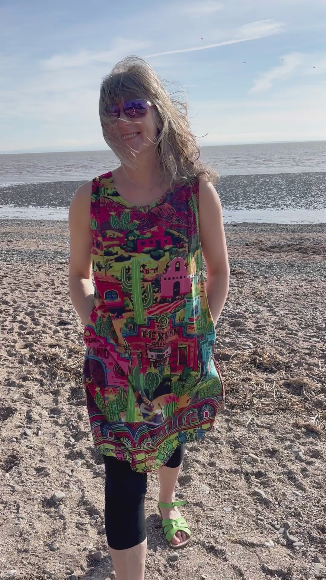 fully reversible A-line shift dress with one side colourful El Paso print and on reverse lime green print with cactus and sombrero print, pockets on both sides