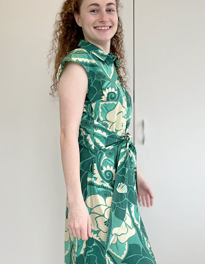 green floral print sleeveless midi length shirt dress with front tie wrap at the waist