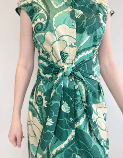 green floral print sleeveless midi length shirt dress with front tie wrap at the waist