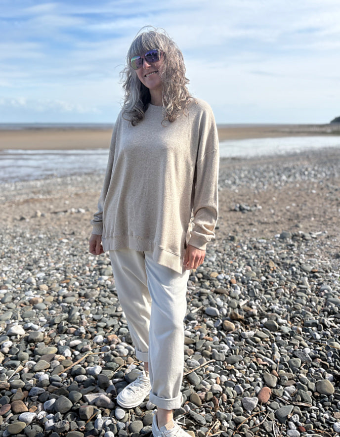beige oversized sweatshirt and cotton cream trousers