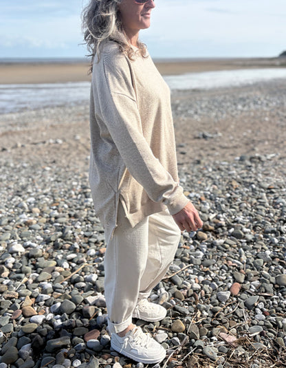 beige oversized sweatshirt and cotton cream trousers