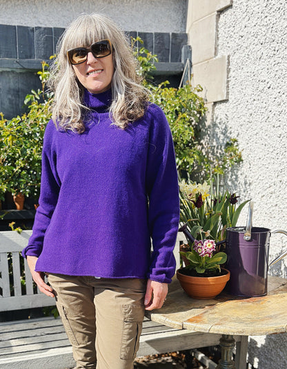 dark purple lambswool,long sweater with raglan sleeves and mock turtle neck. made in Scotland
