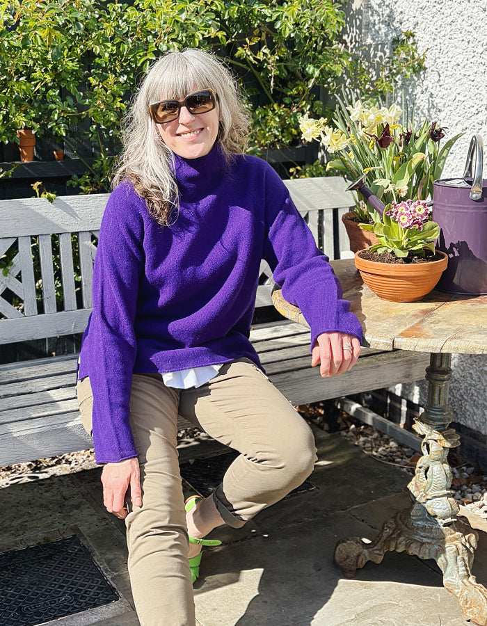 dark purple lambswool,long sweater with raglan sleeves and mock turtle neck. made in Scotland