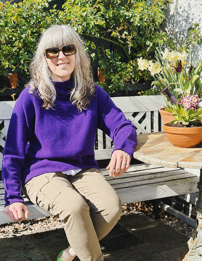 dark purple lambswool,long sweater with raglan sleeves and mock turtle neck. made in Scotland