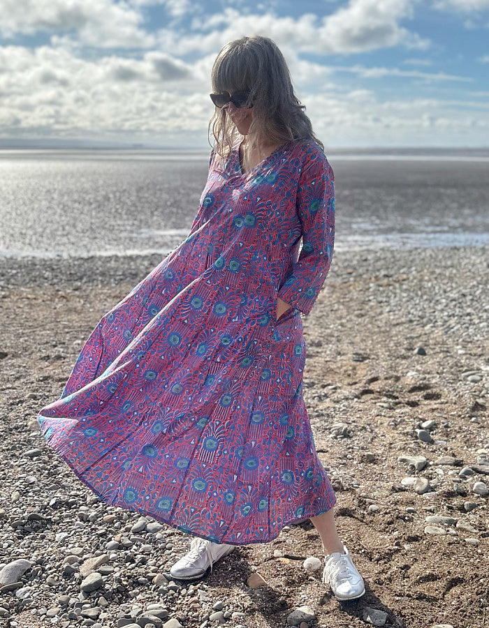 midi length cotton dress with full skirt and pockets and 3/4 length sleeves and V neckline in red and blue hand blocked print