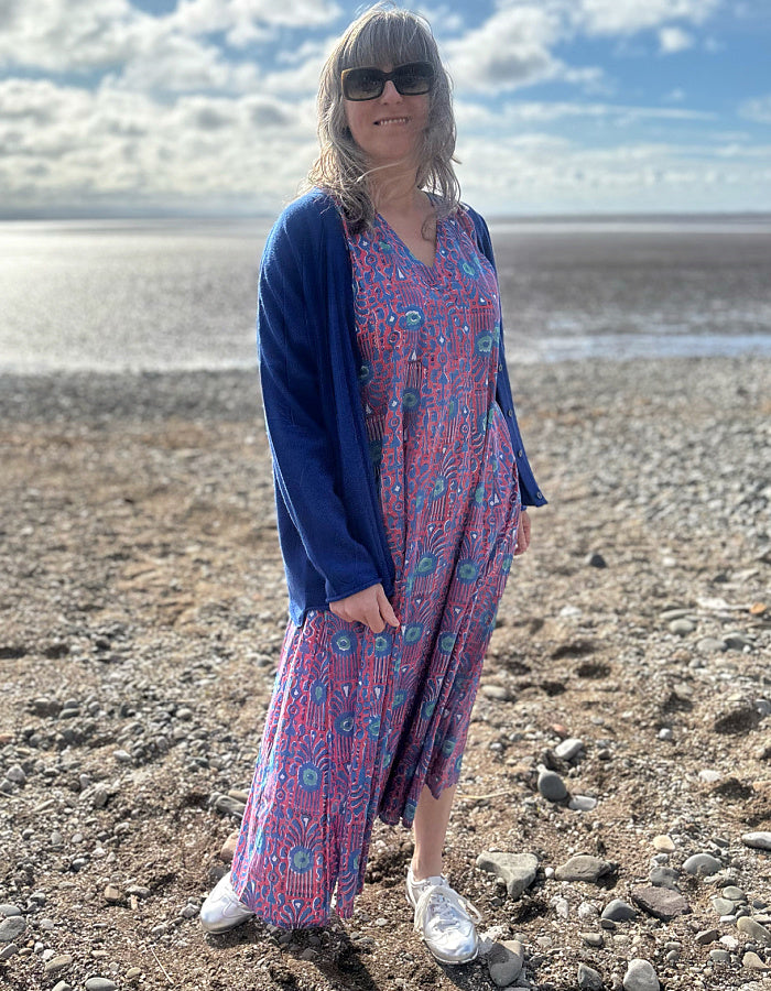 midi length cotton dress with full skirt and pockets and 3/4 length sleeves and V neckline in red and blue hand blocked print