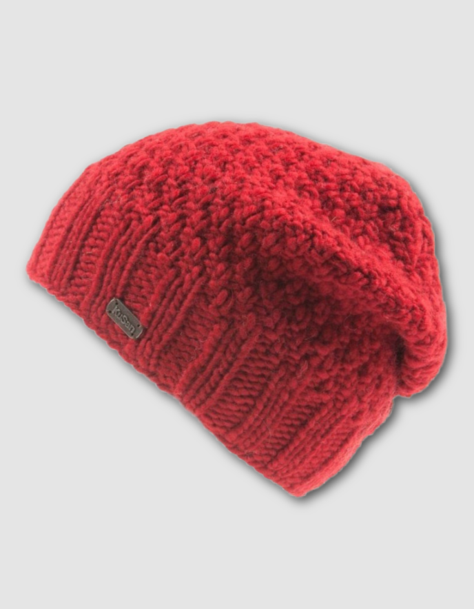 Red knitted beanie on a light gray background