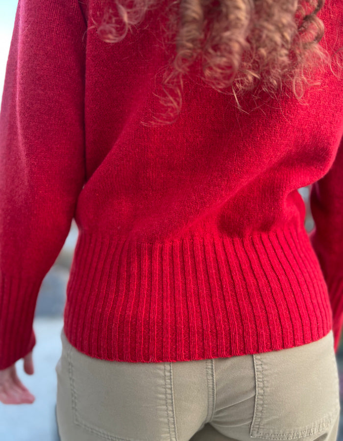 red fitted wool cardigan with deep ribbed hem and cuffs