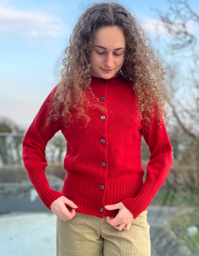 red fitted wool cardigan with deep ribbed hem and cuffs