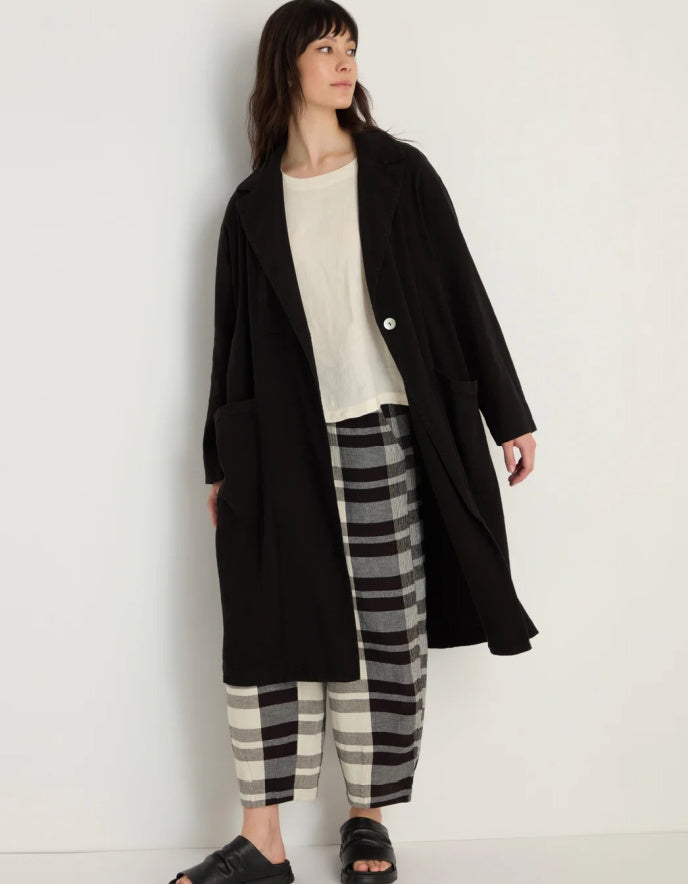 lady wearing black linen duster coat