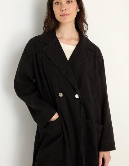 lady wearing black linen duster coat