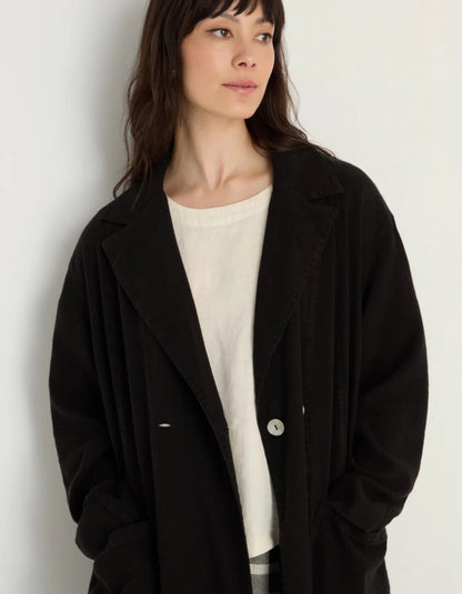 lady wearing black linen duster coat