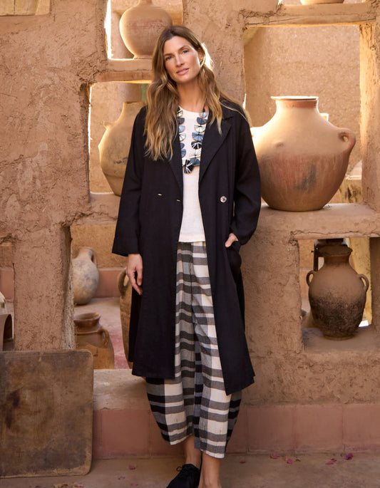 lady wearing black linen duster coat