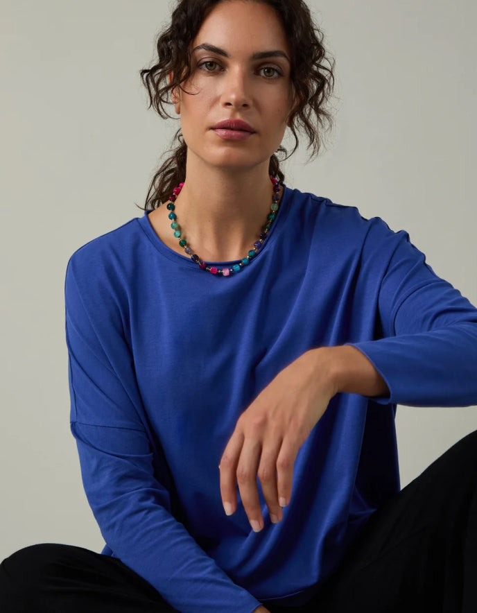 woman wearing loose fit blue t shirt